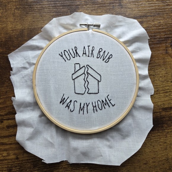White embroidered piece that reads Your Airbnb Was My Home